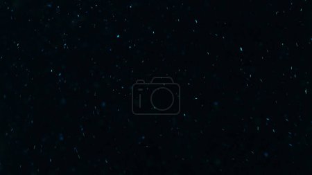 Photo for Glowing particles. Sparkles texture. Shimmer rain. Blur blue color light dust flakes floating on dark black free space abstract background. - Royalty Free Image