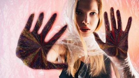 Photo for Future prediction. Nft art. Palmistry fortune. Confident oracle woman face colorful glitch noise hand palms on peach pink glow background. - Royalty Free Image