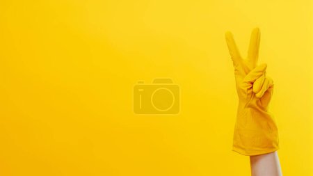 Photo for Janitor services. Professional cleaning. Houseworker hand in protective gloves victory sign gesture isolated on yellow background empty space. - Royalty Free Image