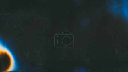 Photo for Glitch overlay. Flare design. Distortion noise. Black scratched background with neon glow blue yellow blurred light spots free space. - Royalty Free Image