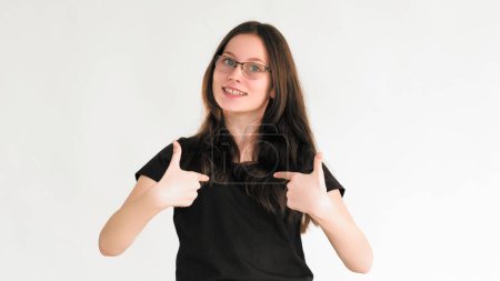 Proud winner. Pick me. Self encouragement. Delighted enthusiastic glad woman in glasses pointing fingers isolated on white empty space background.