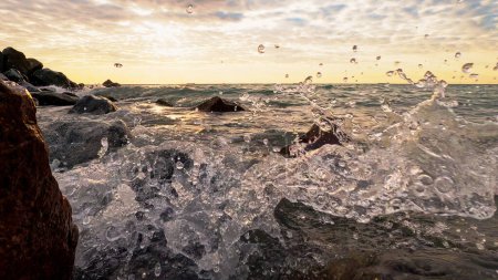 Photo for Rocky shoreline. Seaside nature. Ocean waves with water splash crashing on stones marine coastline sea landscape cloud horizon. - Royalty Free Image