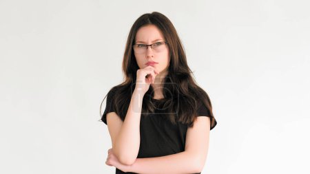Photo for Confused thinking. Problem solution. Pensive skeptic smart woman in glasses considering idea making decision plan isolated on white empty space background. - Royalty Free Image