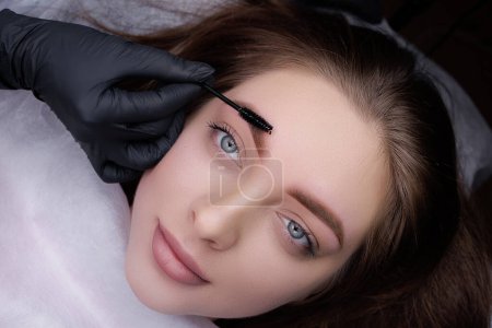 Photo for Eyebrows of a young girl after permanent eyebrow makeup procedure. PMU Procedure, Permanent Eyebrow Makeup. - Royalty Free Image