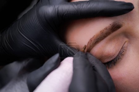 Permanent eyebrow makeup and eyebrow airbrushing. PMU Procedure, Permanent Eyebrow Makeup.