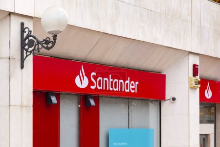 Photo for Spain, November 2021:  Brand Bank Santander with new logo in Madrid, Spain - Royalty Free Image