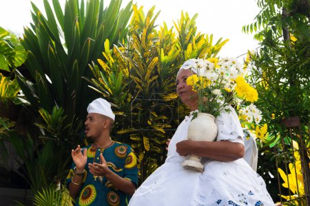 Saubara, Bahia, Brazil - June 12, 2022: Candomble members gathered in traditional clothes for the religious festival in Bom Jesus dos Pobres district, Saubara city.
