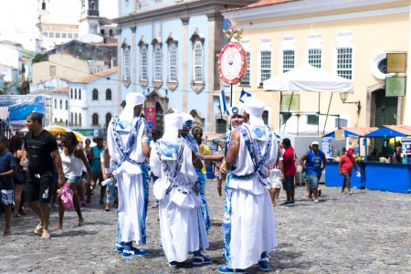Foto de Salvador, Bahia, Brazil - February 11, 2018: Members of the traditional carnival block Filhos de Gandy are seen during the parade at the carnival in Salvador, Bahia. - Imagen libre de derechos
