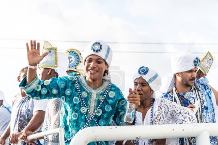 Téléchargez les photos : Salvador, Bahia, Brazil - February 11, 2018: Musicians from the traditional carnival group Filhos de Gandy, parade through the streets of Salvador, Bahia, during Carnival. - en image libre de droit