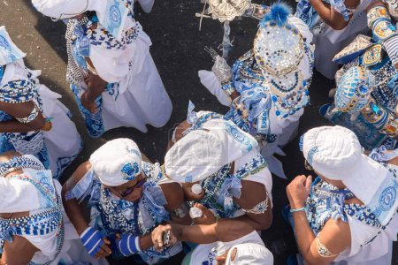 Foto de Salvador, Bahia, Brazil - February 11, 2018: Members of the traditional carnival block Filhos de Gandy parade in Castro Alves square during Carnival in Salvador, Bahia. - Imagen libre de derechos