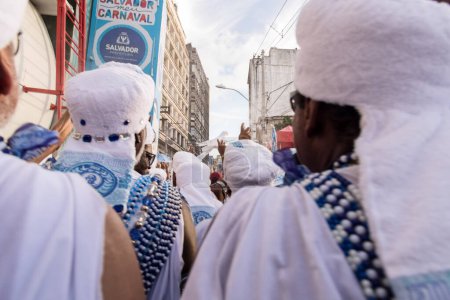 Foto de Salvador, Bahia, Brazil - February 11, 2018: Members of the traditional carnival block Filhos de Gandy parade in the streets of Salvador, Bahia during the 2018 carnival. - Imagen libre de derechos