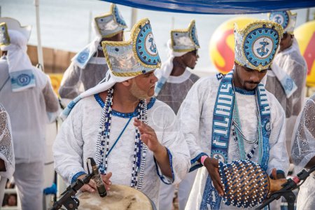 Foto de Salvador, Bahia, Brazil - February 11, 2018: Musicians from the traditional carnival group Filhos de Gandy, parade through the streets of Salvador, Bahia, during Carnival. - Imagen libre de derechos