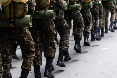 Photo for Salvador, Bahia, Brazil - September 07, 2022: Army soldiers standing with war gear are seen during the Brazilian independence day parade. Salvador, Bahia. - Royalty Free Image