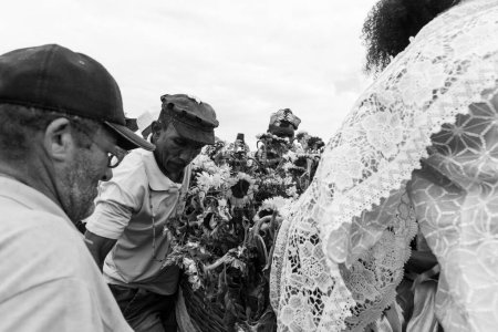 Photo for Santo Amaro, Bahia, Brazil - May 15, 2022: Candomble members are seen placing gifts for Iemanja on Itapema beach, during the Bembe do Mercado celebrations in Santo Amaro. - Royalty Free Image
