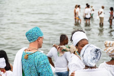 Photo for Santo Amaro, Bahia, Brazil - May 15, 2022: Candomble members are seen on Itapema beach during the Bembe do Mercado celebrations, in the city of Santo Amaro. - Royalty Free Image