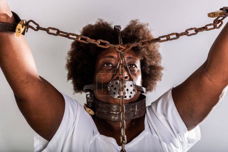 Photo for Portrait of a black woman in chains, representing the slave Anastacia. Slavery in Brazil. - Royalty Free Image