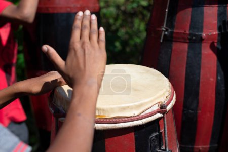 Photo for Brazilian atabaque being played by the hands of a musician. Feeling of power and speed. Constant pace. Acupe, Santo Amaro, Bahia. - Royalty Free Image