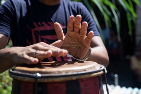 Photo for Hands of a musician playing the atabaque. Constant and perfect rhythm. Feeling of power and speed - Royalty Free Image