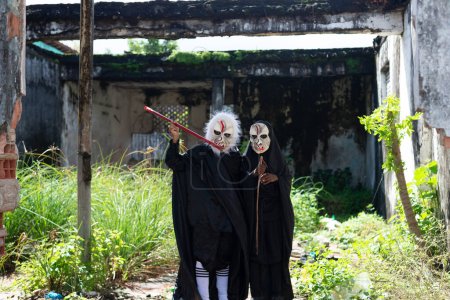 Photo for Santo Amaro, Bahia, Brazil - July 24, 2022: People dressed in horror clothes and masks during a cultural demonstration in Acupe, Santo Amaro Bahia. - Royalty Free Image