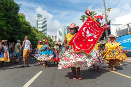 Salvador, Bahia, Brazil - February 11, 2023: Cultural group from the city of Sao Francisco do Conde is seen parading in Fuzue, pre-carnival in Salvador, Bahia, Brazil.