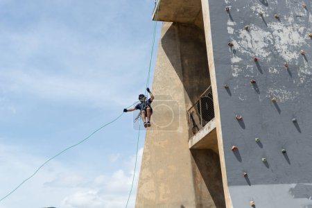 Salvador, bahia, Brazil - January 07, 2024: Rappelist descending from a great height. Healthy and dangerous sport. Lifestyle.