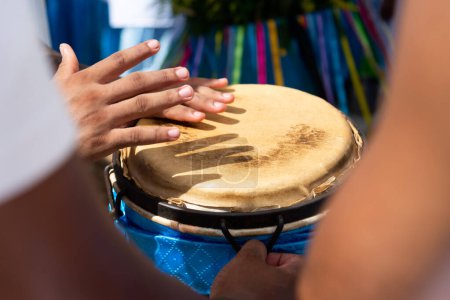 Percussionist hands playing atabaque. Tribute to Iemanja.