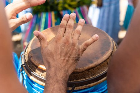 Percussionist hands playing atabaque. Tribute to Iemanja.
