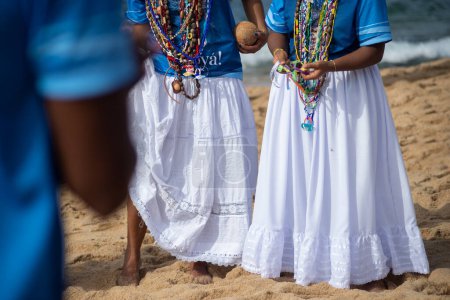 Salvador, Bahia, Brazil - February 02, 2024: Candomble fans are seen paying homage to Iemanja on Rio Vermelho beach, in the city of Salvador, Bahia.