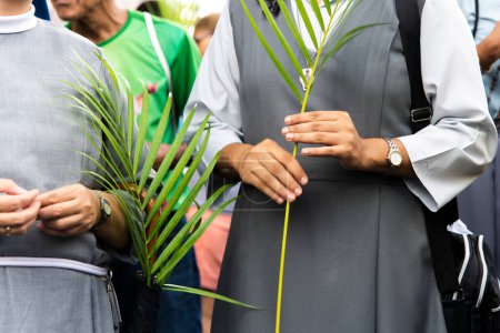 Photo for Salvador, Bahia, Brazil - April 14, 2019: Catholics are seen walking and praying during Palm Sunday celebration in the city of Salvador, Bahia. - Royalty Free Image