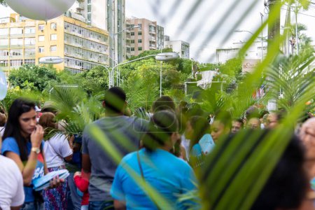 Photo for Salvador, Bahia, Brazil - April 14, 2019: Hundreds of people are seen participating in the Palm Sunday procession in the city of Salvador, Bahia. - Royalty Free Image