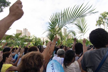 Photo for Salvador, Bahia, Brazil - April 14, 2019: Hundreds of people are seen participating in the Palm Sunday procession in the city of Salvador, Bahia. - Royalty Free Image