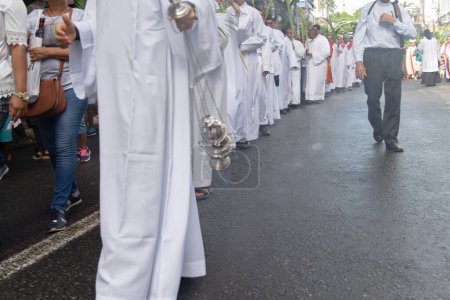 Photo for Salvador, Bahia, Brazil - April 14, 2019: Priests are seen participating in the Palm Sunday procession in the city of Salvador, Bahia. - Royalty Free Image
