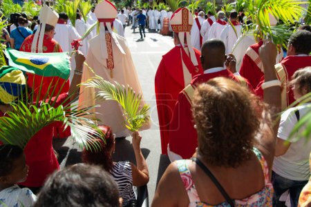 Photo for Salvador, Bahia, Brazil - April 14, 2019: Thousands of Catholics are seen participating in the Palm Sunday procession in the city of Salvador, Bahia. - Royalty Free Image