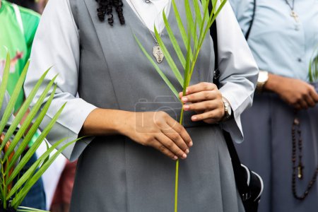 Photo for Salvador, Bahia, Brazil - April 14, 2019: Catholics are seen participating in the Palm Sunday procession in the city of Salvador, Bahia. - Royalty Free Image