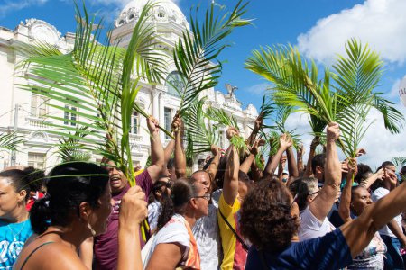 Photo for Salvador, Bahia, Brazil - April 14, 2019: Crowds of Catholics are seen participating in the Palm Sunday procession in the city of Salvador, Bahia. - Royalty Free Image