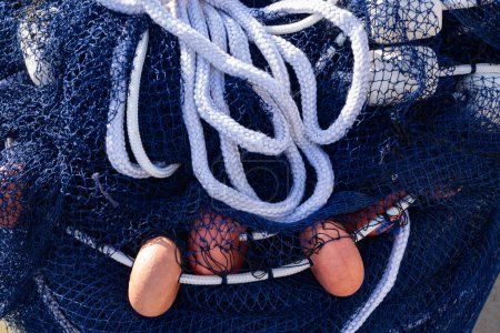 A balled-up blue professional fishing net. Fishing and leisure.