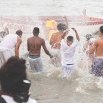 Santo Amaro, Bahia, Brazil - May 19, 2019: Members of Candomble are seen performing rituals during a tribute to iemanja on Itapema beach in the city of Santo Amaro, Bahia.
