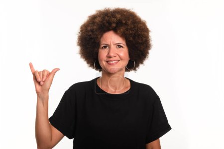 Female interpreter of the Brazilian sign language, Libras, making the letter Y. Isolated on white background.