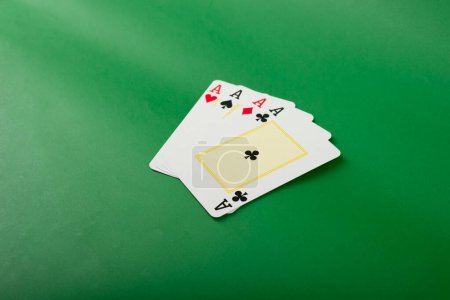 Photo for Playing card for poker and gambling, four aces. Isolated on green background. - Royalty Free Image