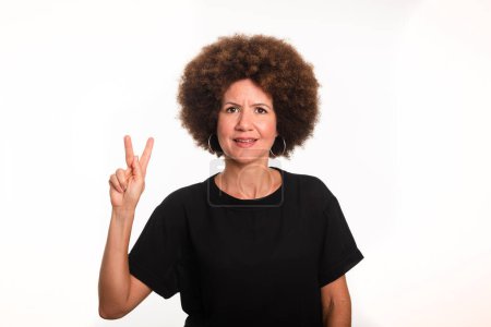Female interpreter of the Brazilian sign language, Libras, making the letter H. Isolated on white background.