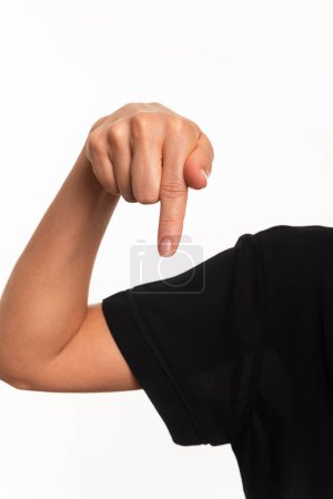 Close-up of a hand making the letter Q in the sign language for the deaf in Brazil, Libras. Isolated on white background.