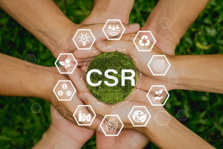 RSE (Entreprise sociale et responsabilité) icône concept entre les mains de l'entreprise et de l'organisation.Concept de donner en retour à la communauté sur un fond de nature verte.
