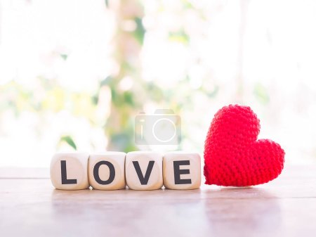Foto de Love on wooden cubes with red heart for Valentine's day concept. - Imagen libre de derechos