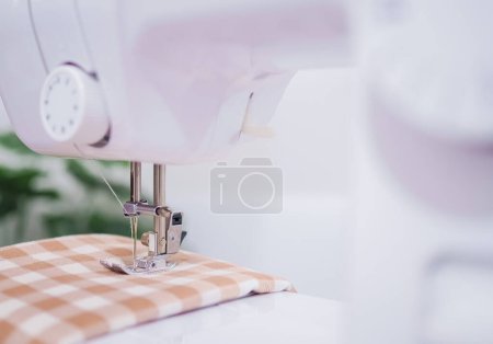 Photo for Close up sewing machine stitch new clothing. - Royalty Free Image