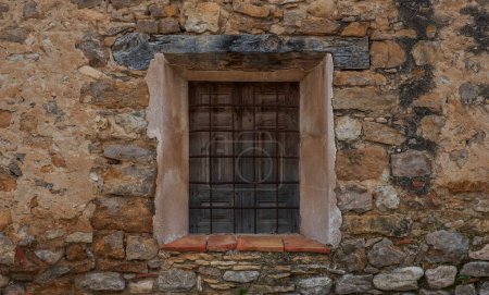 Window in the old stone wall.