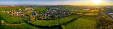 Photo for Panoramic view of the village of Donore in Ireland, surrounded by vast fields - Royalty Free Image