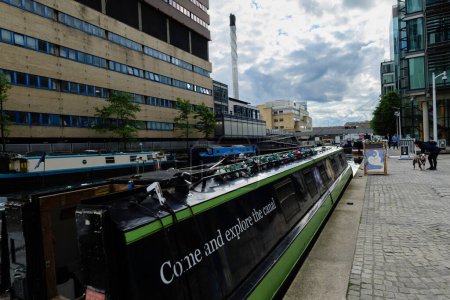 Photo for London - 05 28 2022: Docking of boats in Merchant Square in Paddington Basin navigating the Grand Union Canal - Royalty Free Image