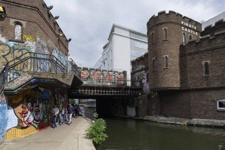 Photo for London - 29 05 2022: Close up of the Oval Rd bridge and the Pirate Castle along the Regent's Canal - Royalty Free Image