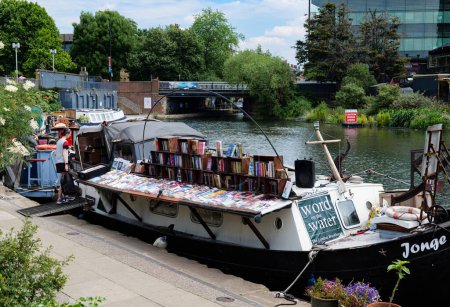 Photo for London - 06 03 2022: Word On The Water - Houseboat transformed into a book shop on the Regent's Canal in Granary Square - Royalty Free Image