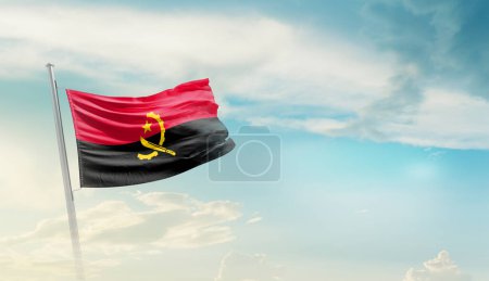 Téléchargez les photos : Angola waving flag in beautiful sky. - en image libre de droit
